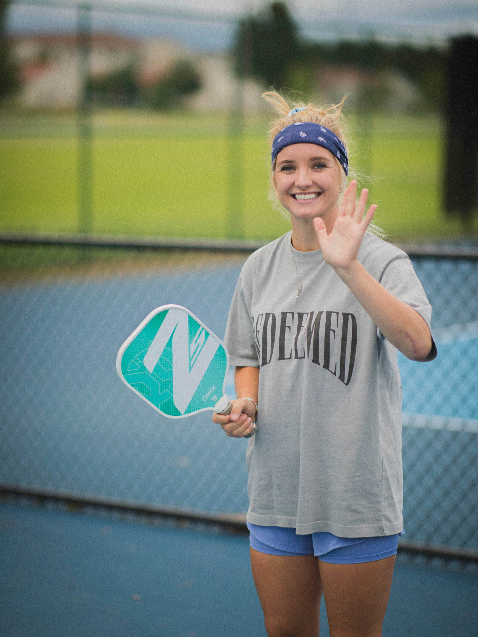A player smiling courtside