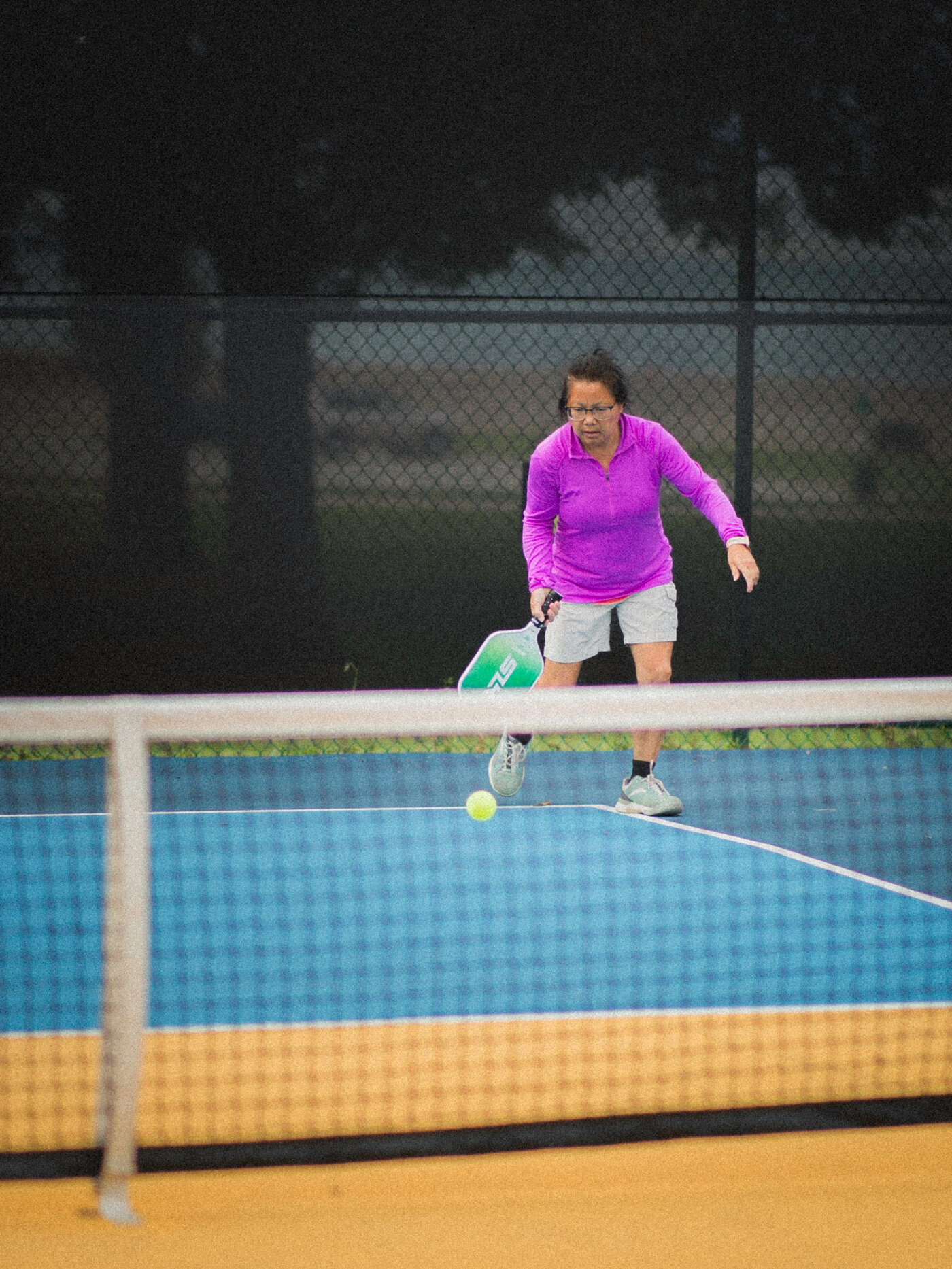 A player dinking at the net